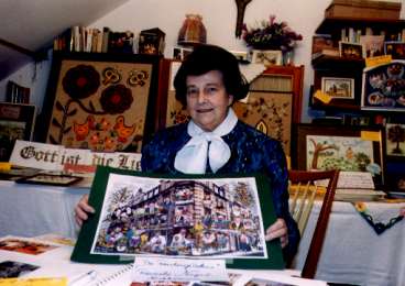 That's my mother in the middle of her artworks